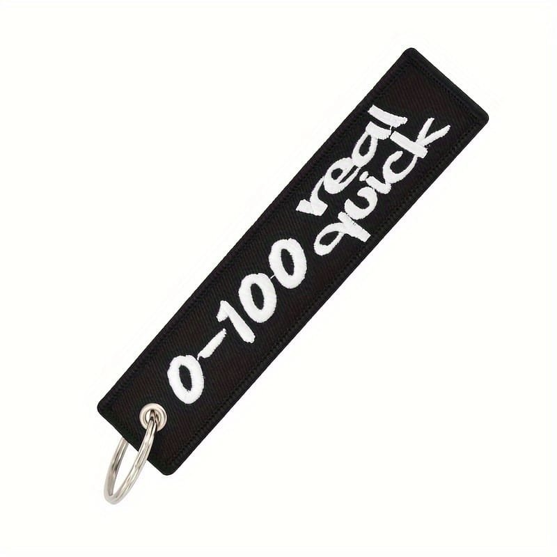 Keyring 0-100 Real Quick - black material with white embroidered lettering.