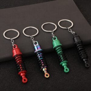 Functional shock absorber keyring, simulating a car shock absorber with spring.