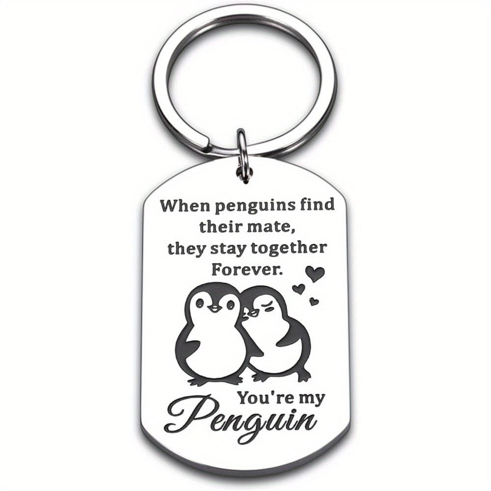 Engraved pendant with penguins and love note
