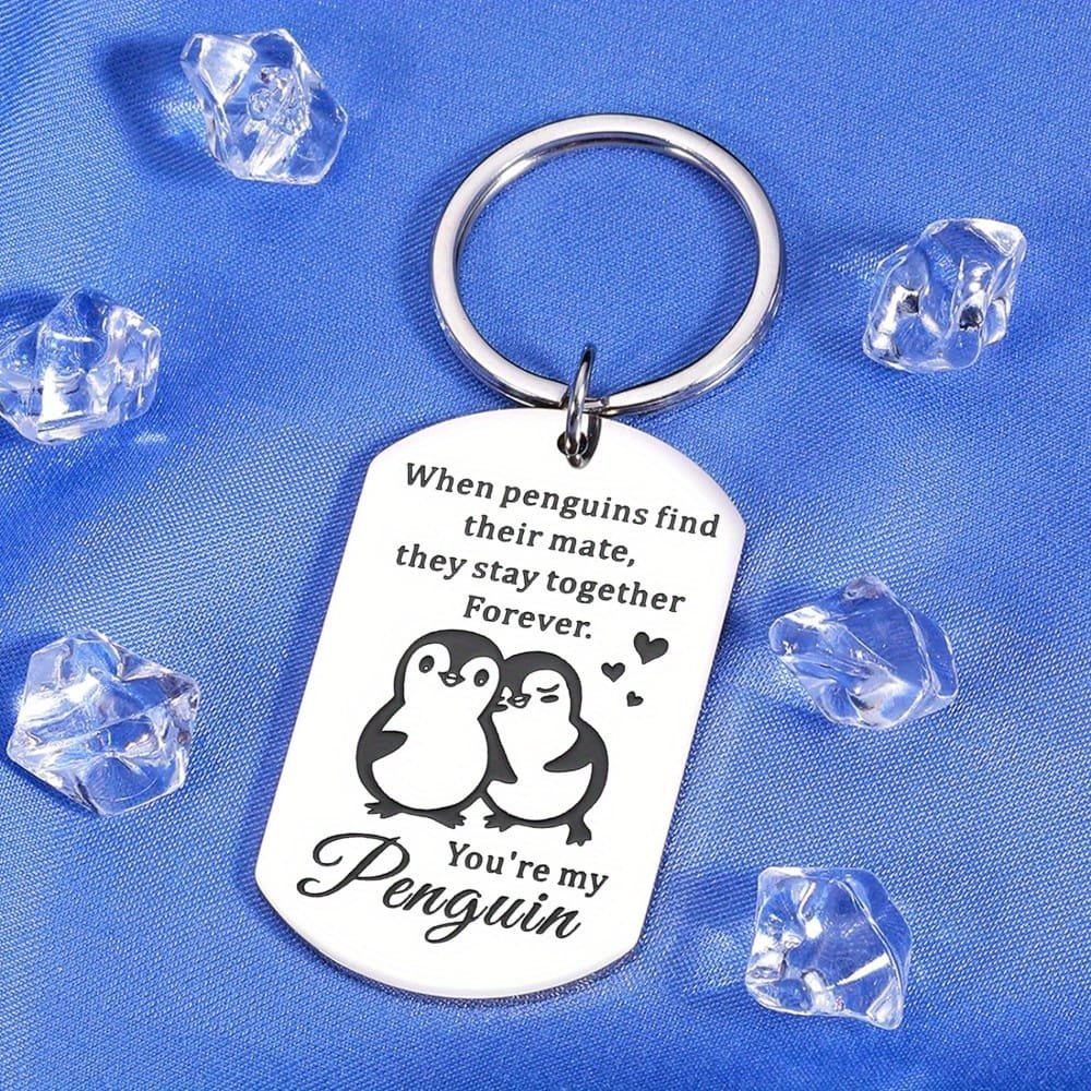 Engraved pendant with penguins and love note