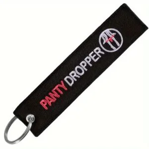 Panty Dropper - mustast materjalist punase ja valge kirjaga ning punaste aluspükstega ringikujulise logoga.