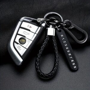 Punutud nahast võtmehoidja koos telefoninumbri ümbrisega