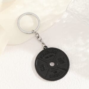 Pancake keyring - black miniature weight for gym lovers.