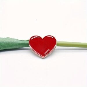 metal red heart badge with gold accents