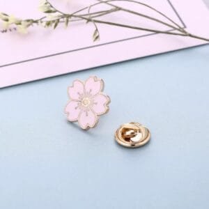 Metal brooch in the shape of cherry blossoms with enamel