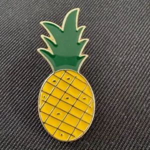 Pineapple-shaped badge with enamel coating