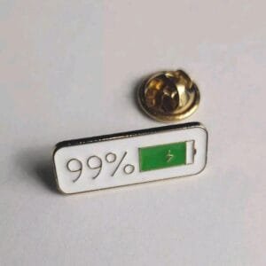 Horizontal white enamel pin with 99 per cent and green battery icon with lightning bolt symbol pin accessory