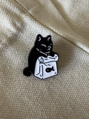 Black cat in shopping bag with fish symbol enamel pin pin cat in bag accessory
