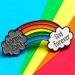 Colorful rainbow gray and white cloud inscription Storms don't last forever enamel pin motivation