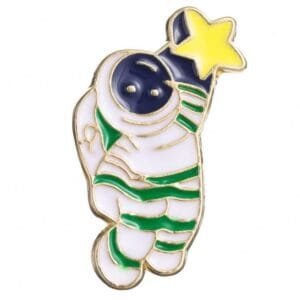 White astronaut with green stripes reaching for a yellow star enamel pin space