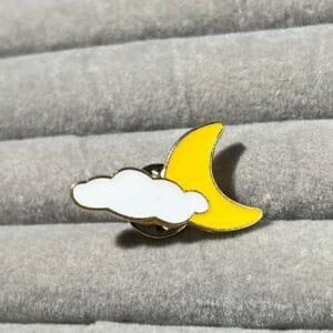 Bright yellow crescent moon white cloud night sky enamel pin minimalist design